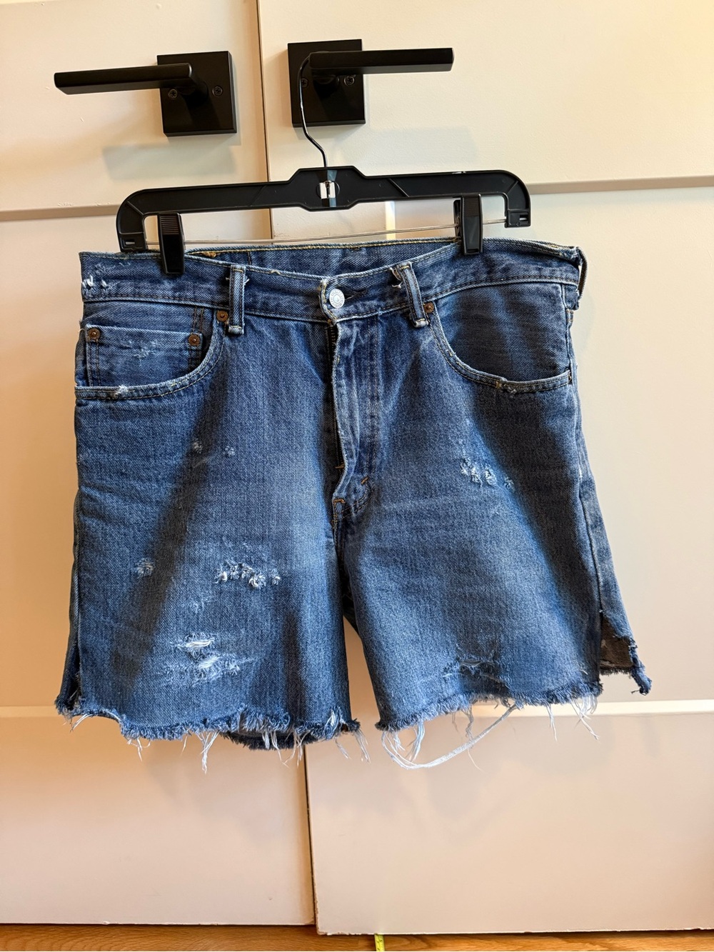 Levi’s Distressed Dark Blue Denim Cutoff Shorts